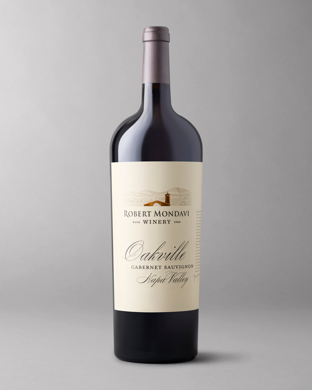 A magnum bottle of Cabernet Sauvignon on a grey background
