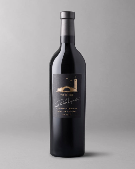 A bottle of 2018 To Kalon Reserve Cabernet Sauvignon on a grey background.