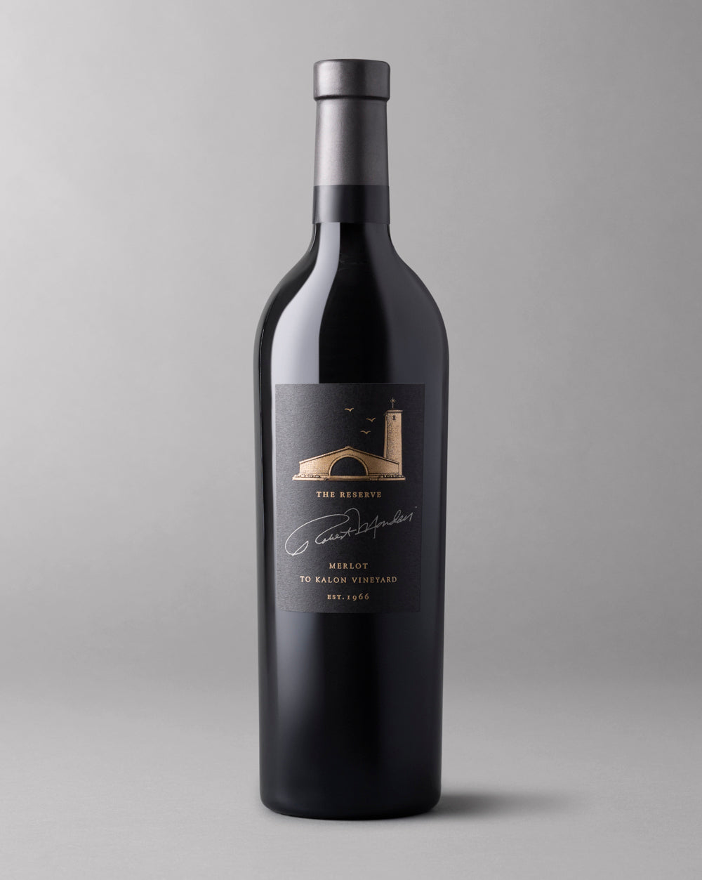 A bottle of 2021 Reserve Merlot To Kalon Vineyard on a light grey background