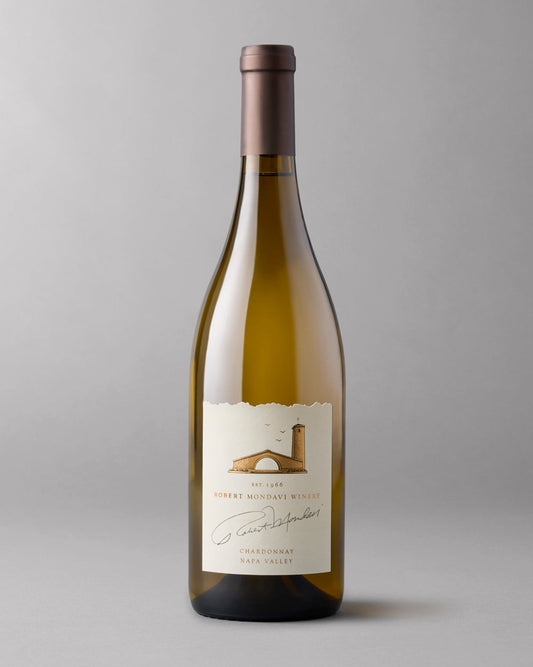 A bottle of 2021 Chardonnay Napa Valley on a grey background.