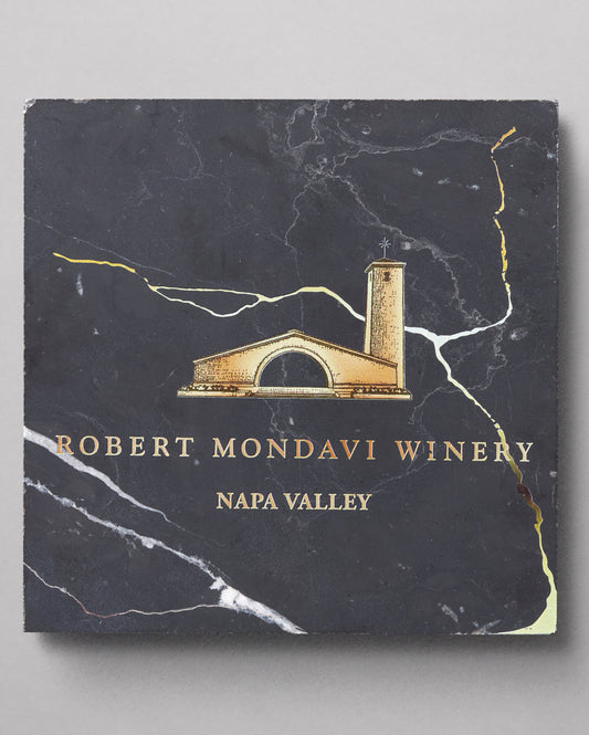 Handcrafted Black and Gold Marble Coasters with the Robert Mondavi Winery logo on it in gold