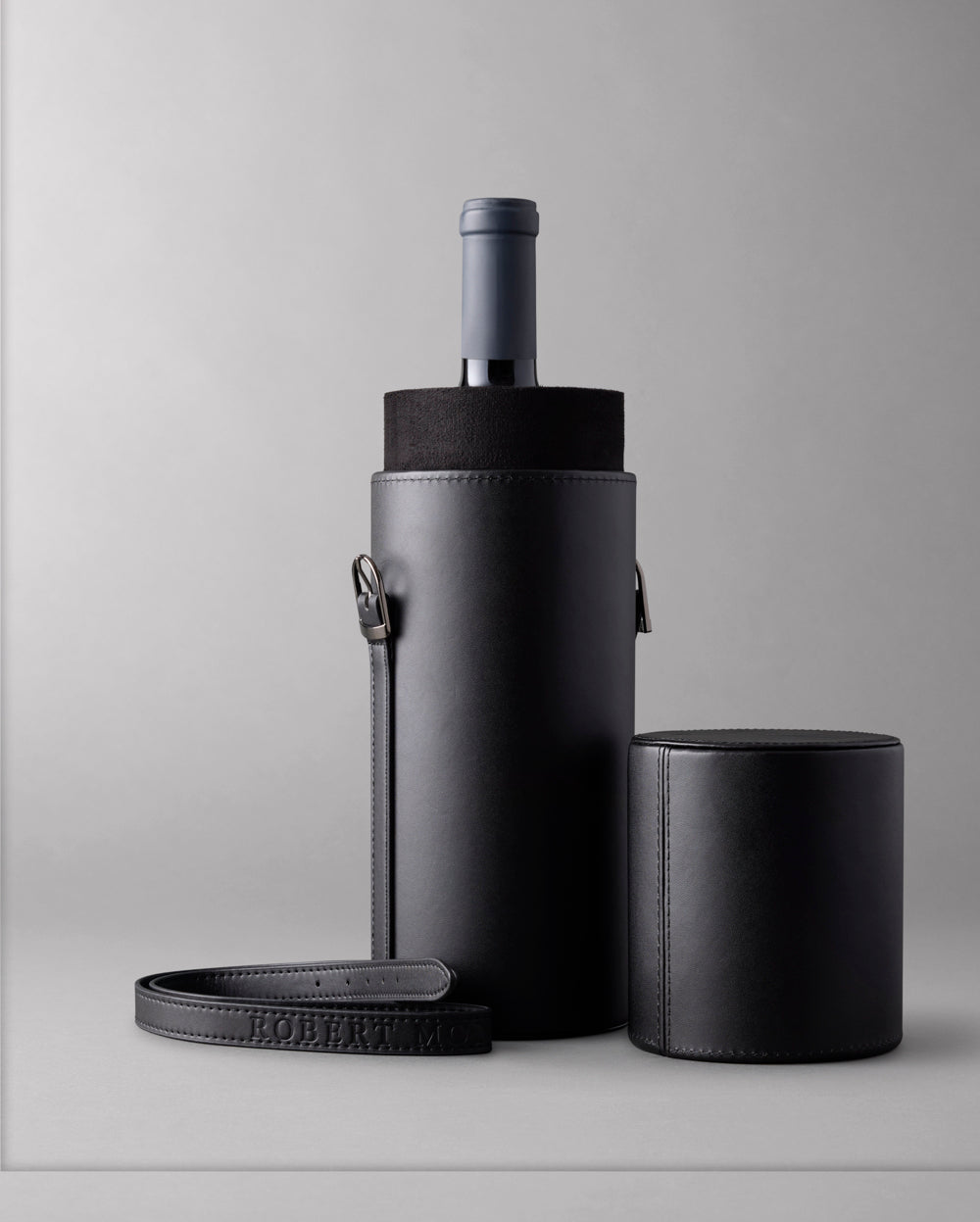 Single Bottle Wine Carrier made from vegan leather, with the  Arch & Tower embossed on the cap